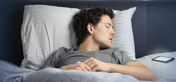 man asleep in bed with mobile phone
