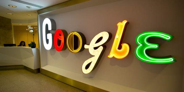 In this Monday, Oct. 28, 2013 photo, Google's trademark name lights up the lobby to the company's offices in New York. (AP Photo/Mark Lennihan)